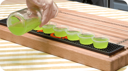 margarita jello shots being poured into cups