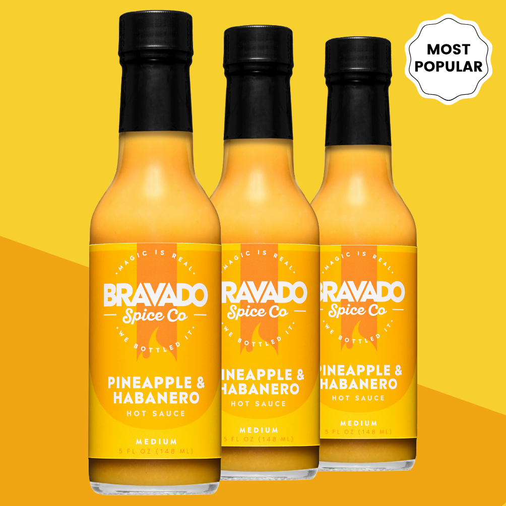 Bravado Spice Co Pineapple & Habanero Hot Sauce labeled "Most Popular" and "Medium" - tropical pineapple habanero sauce in 5 oz bottles.